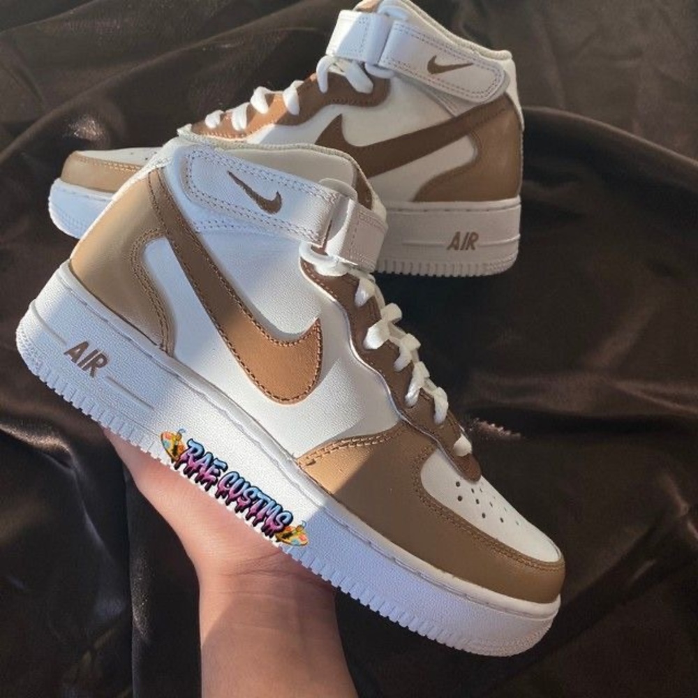 Tan and white Nike shoes